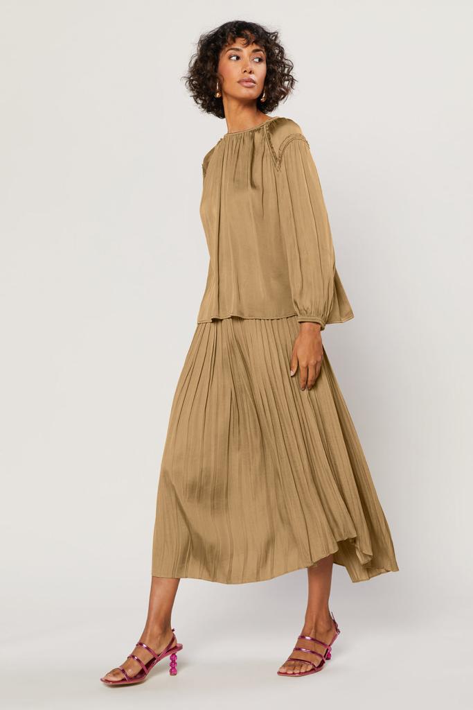 Pretty pleats flow to a rounded hem on this easy-wearing A-line skirt that's cinched up top by an elasticized waist. Wear it with a slinky cami or a little tee on warmer days, and then layer on a slouchy sweater when the temperature cools off