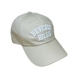 beige cap with white letters beverly hills